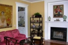 Interior house painting with yellow walls and white trim in Austin
